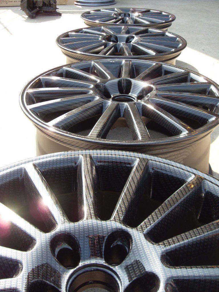 Car alloy wheels coated in carbon fibre