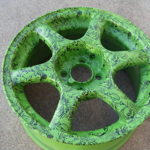 Car alloy wheels coated in skull painted green