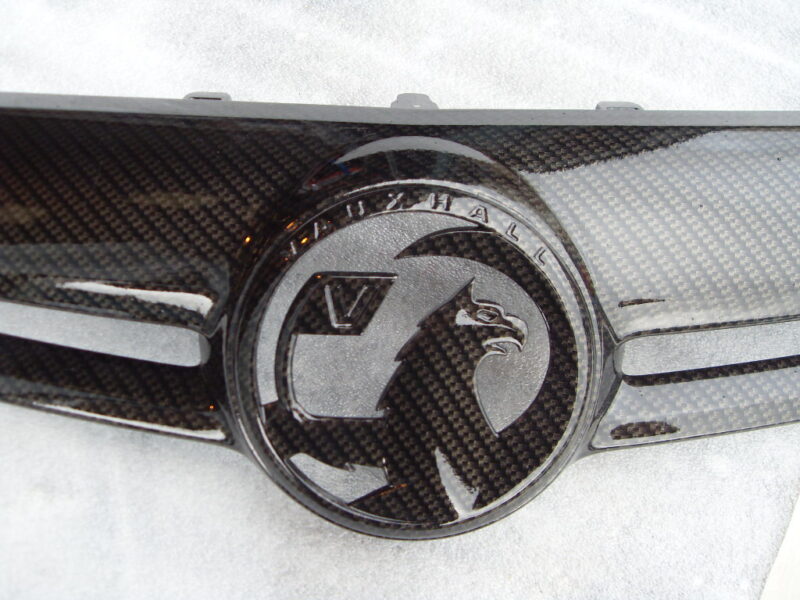 Various car exterior coated in carbon fibre