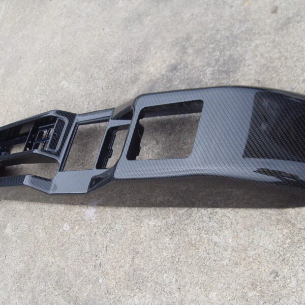Car interior parts coated in carbon fibre hydrographic film painted black