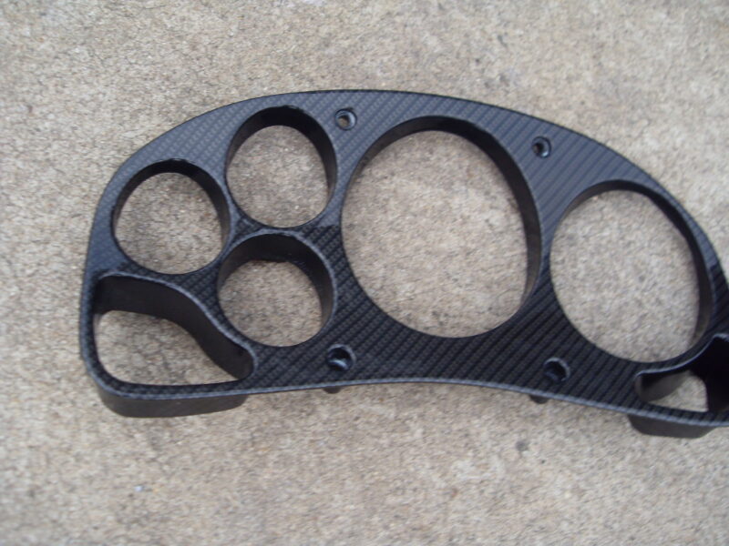 Car interior parts coated in carbon fibre hydrographic film painted black