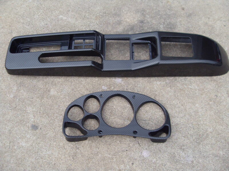 Car interior parts coated in carbon fibre hydrographic film painted black