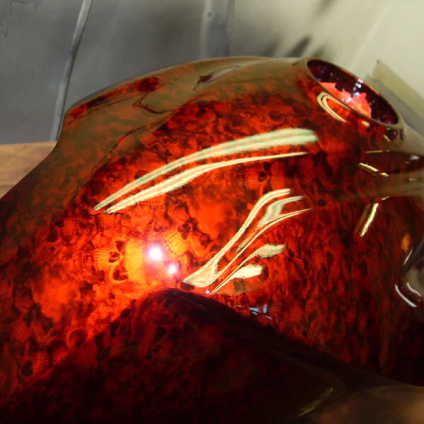Motorbike tank coated in skull painted red