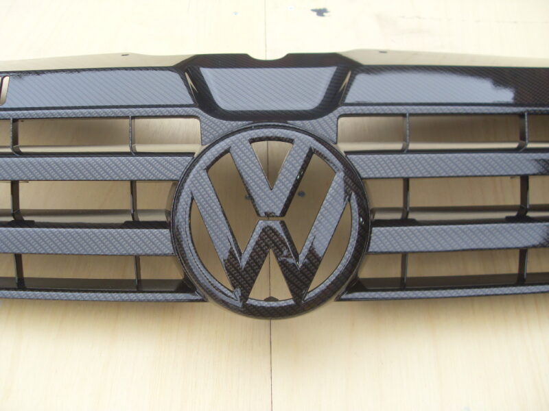 VW radiator cover coated in carbon fibre hydrographic film painted black