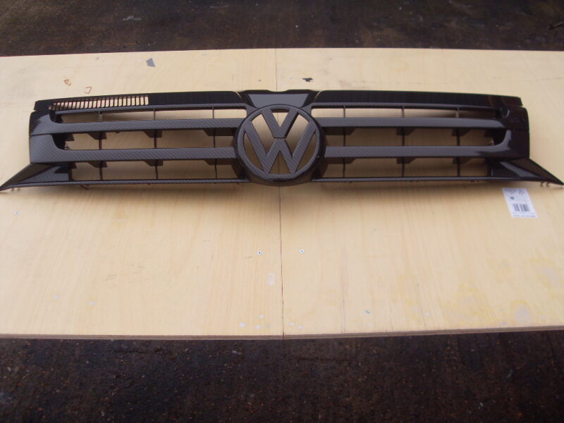 VW radiator cover coated in carbon fibre hydrographic film painted black