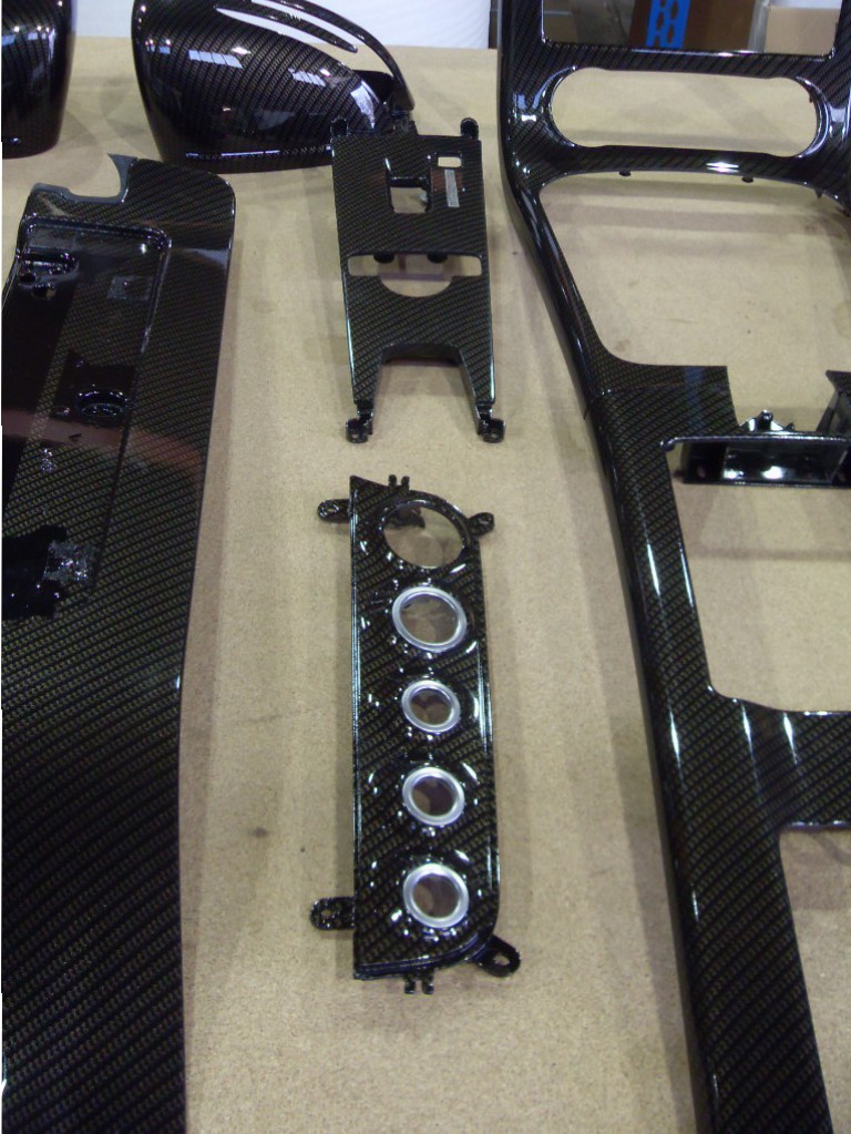 Car interior various parts coated in carbon fibre hydrographic film painted black