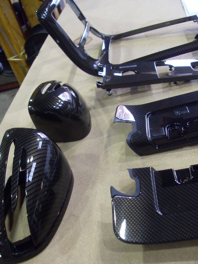Car interior various parts coated in carbon fibre hydrographic film painted black