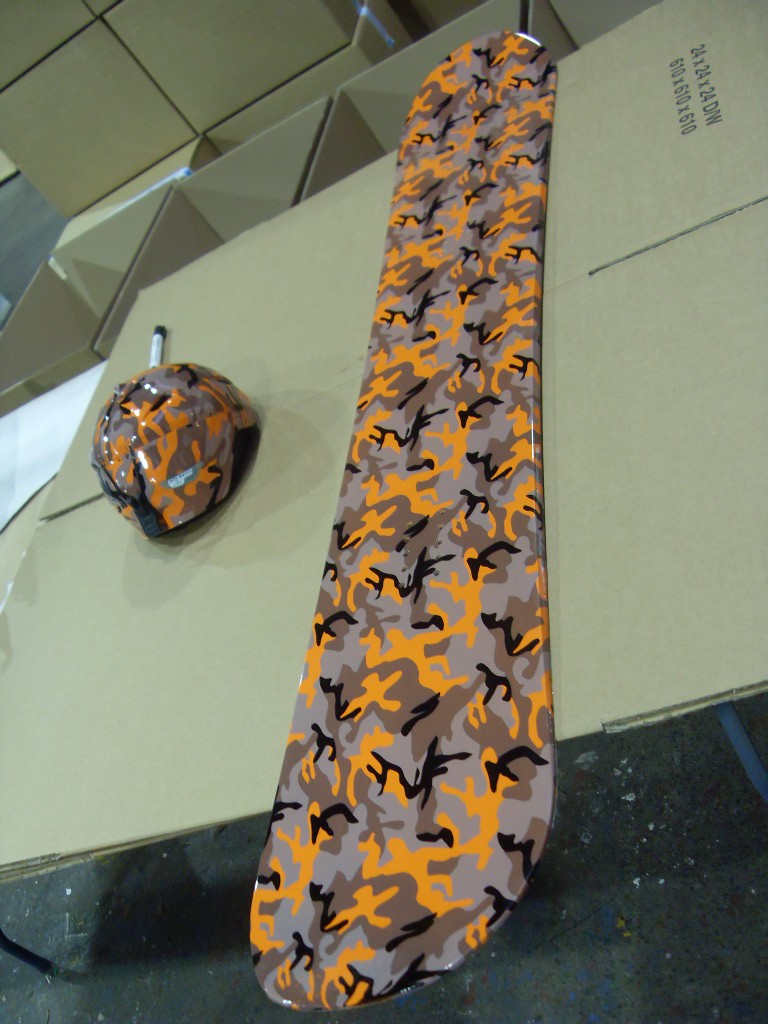 Snowboard And Protective Helmet Coated On Camouflage Hydrographic Film