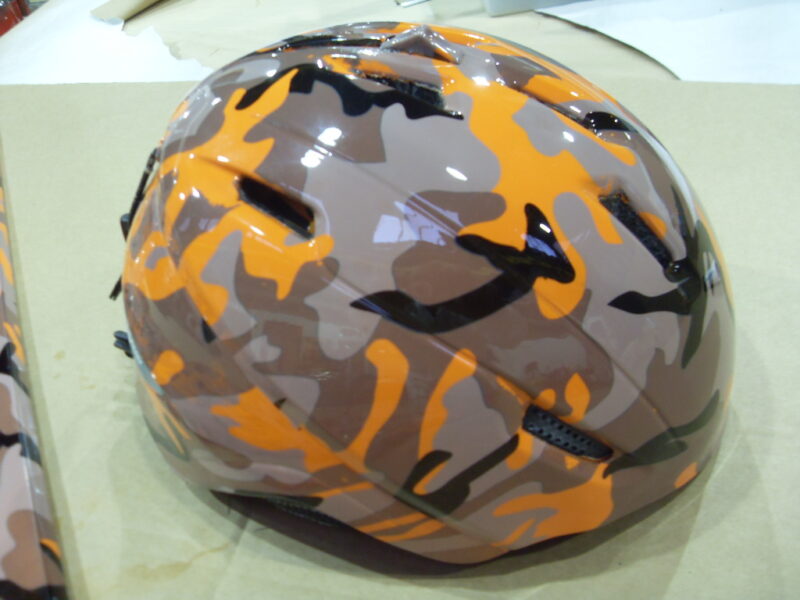 Snowboard And Protective Helmet Coated On Camouflage Hydrographic Film