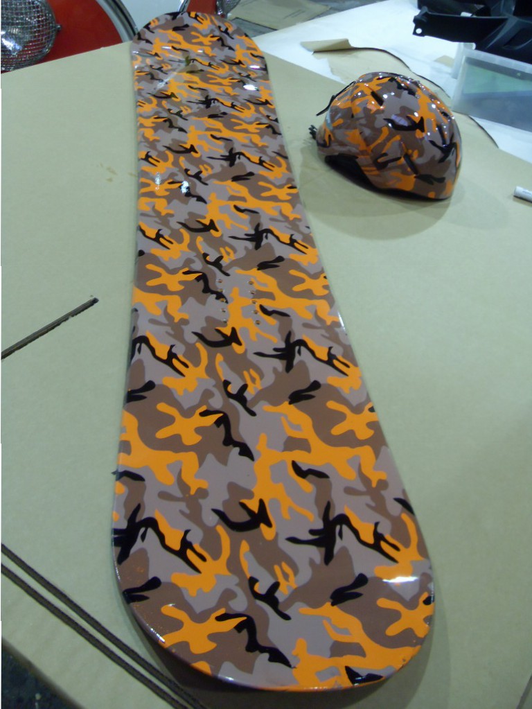 Snowboard And Protective Helmet Coated On Camouflage Hydrographic Film