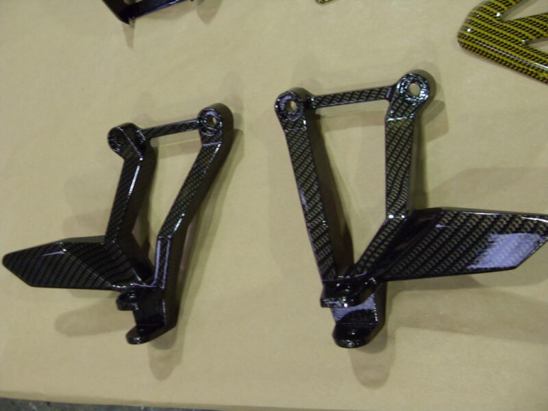 Motorbike various parts coated in carbon fibre hydrographic film painted black and yellow