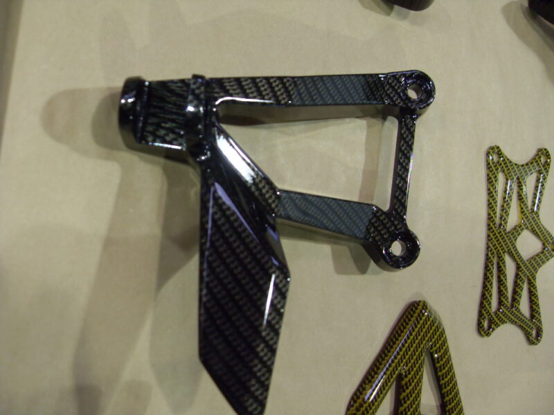 Motorbike various parts coated in carbon fibre hydrographic film painted black and yellow