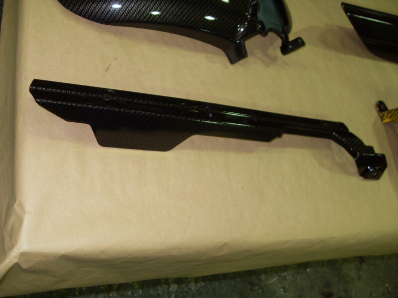 Motorbike various parts coated in carbon fibre hydrographic film painted black and yellow