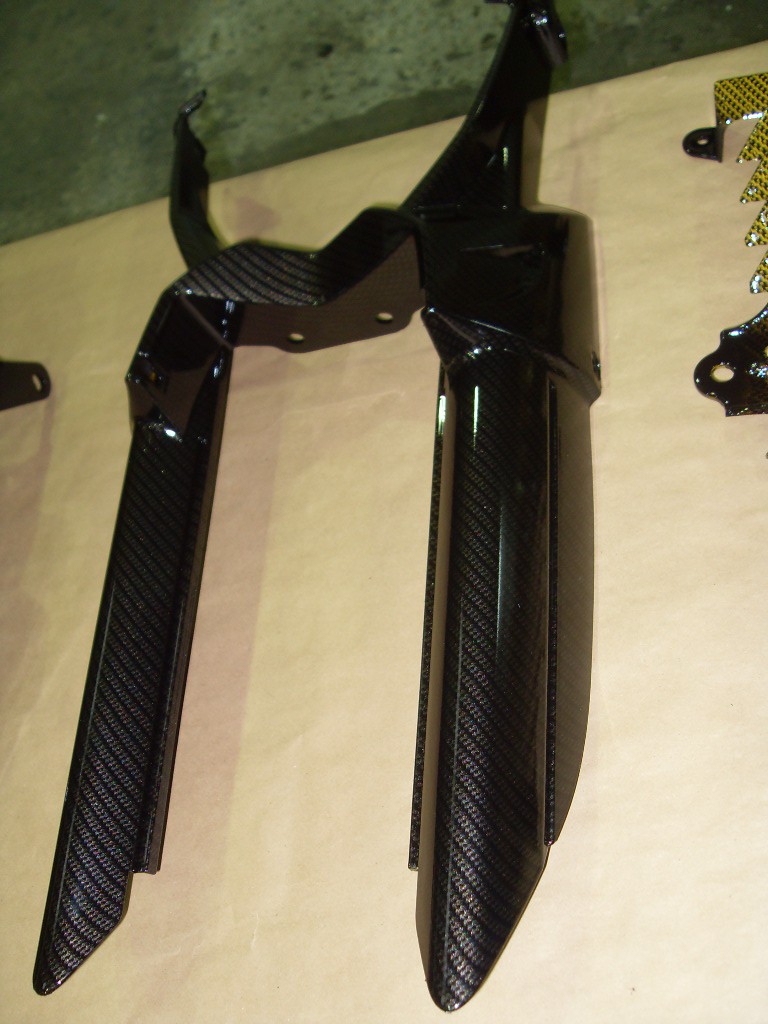 Motorbike various parts coated in carbon fibre hydrographic film painted black and yellow