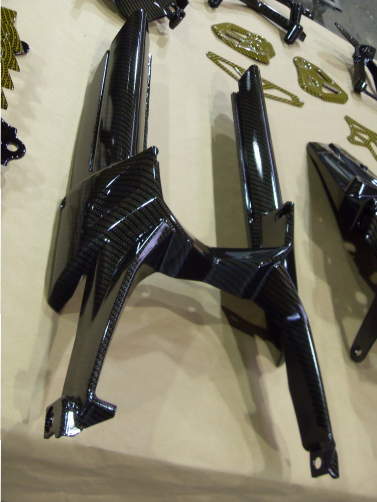 Motorbike various parts coated in carbon fibre hydrographic film painted black and yellow