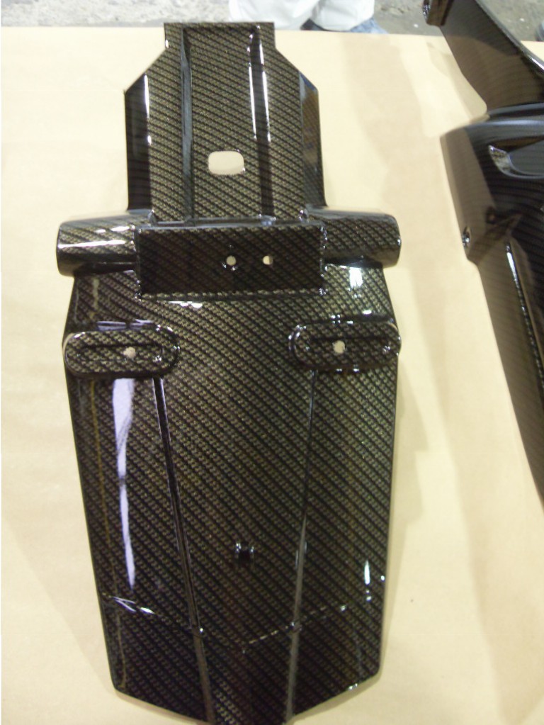 Motorbike various parts coated in carbon fibre hydrographic film painted black and yellow
