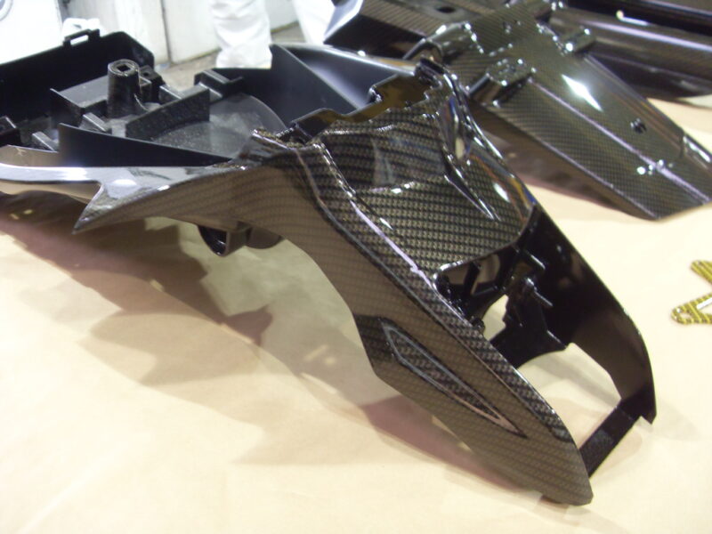 Motorbike various parts coated in carbon fibre hydrographic film painted black and yellow