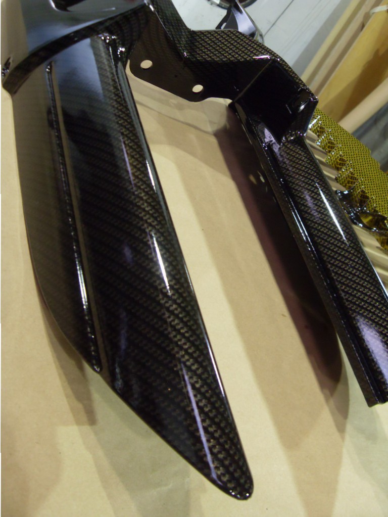 Motorbike various parts coated in carbon fibre hydrographic film painted black and yellow