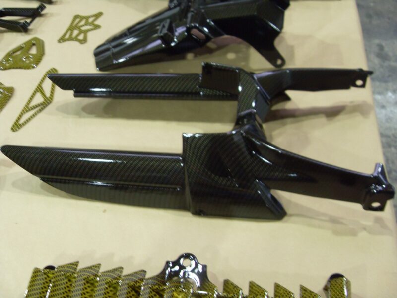 Motorbike various parts coated in carbon fibre hydrographic film painted black and yellow
