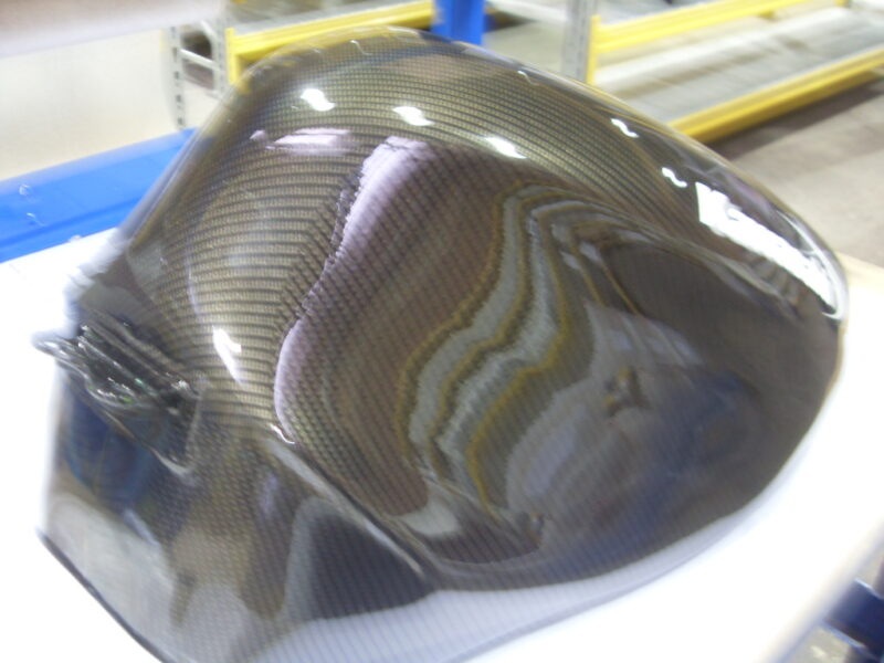 Motorbike tank coated in carbon fibre hydrographic film painted black