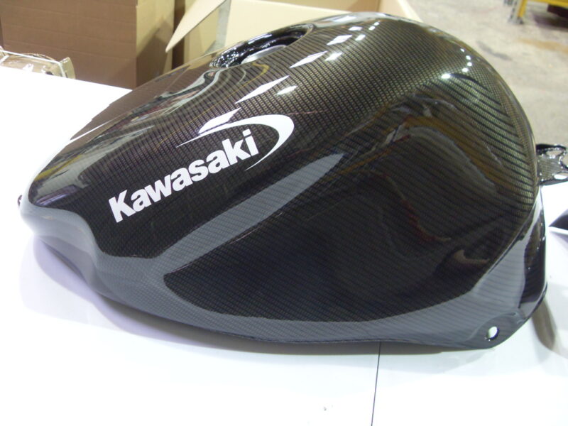 Motorbike tank coated in carbon fibre hydrographic film painted black