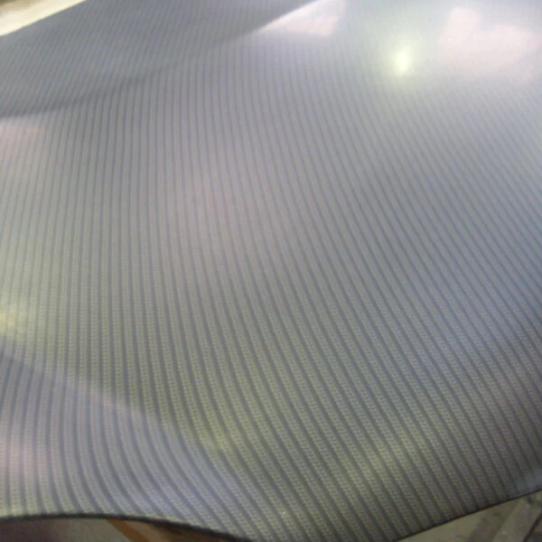 Car hood coated in carbon fibre painted silver