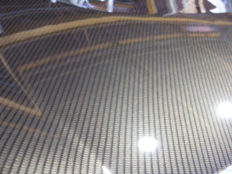 Car hood coated in carbon fibre hydrographic film painted grey