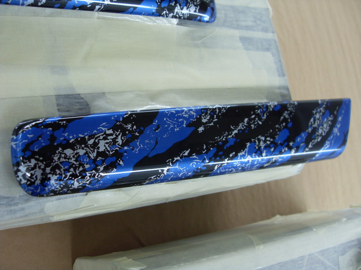 Random Items Coated In Blue Abstract Hydrographic Film.