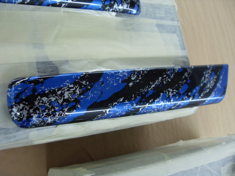 Random Items Coated In Blue Abstract Hydrographic Film.
