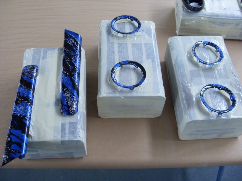 Random Items Coated In Blue Abstract Hydrographic Film.