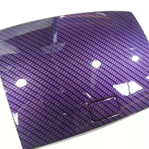 Car dashboard elements coated in carbon fibre hydrographic film painted purple