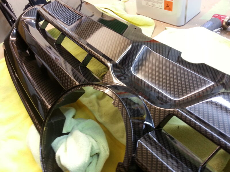 VW radiator grill coated in carbon fibre hydrographic film painted black