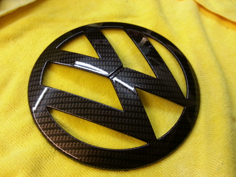 VW radiator grill coated in carbon fibre hydrographic film painted black