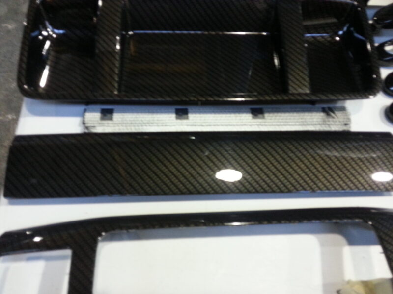Car interior various elements coated in carbon fibre hydrographic film painted black