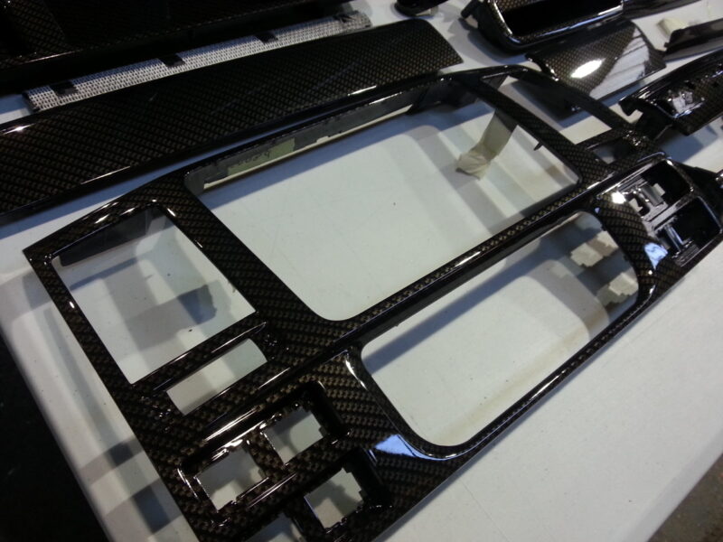 Car interior various elements coated in carbon fibre hydrographic film painted black