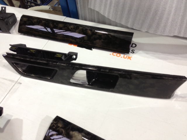 Car dashboard elements coated in skull hydrographic film painted black