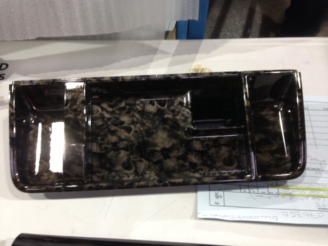 Car dashboard elements coated in skull hydrographic film painted black