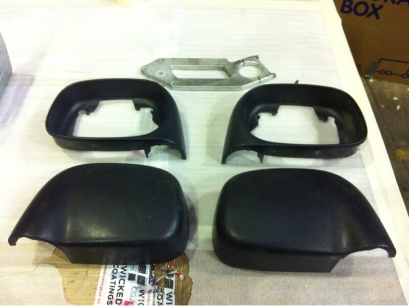 Car mirrors cover coated in carbon fibre