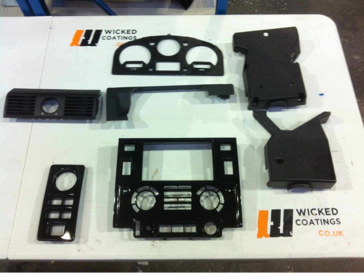 Parts of dashboard coated in carbon fibre