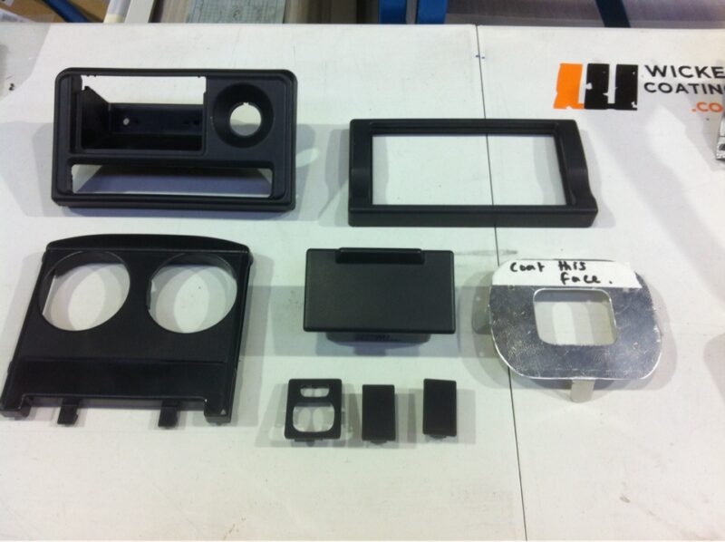 Car dashboard elements coated in carbon fibre