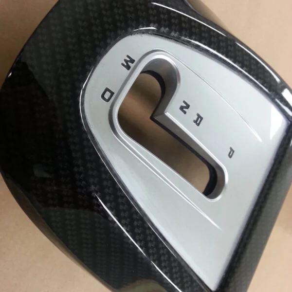 Car interior part coated in carbon fibre hydrographic film painted black