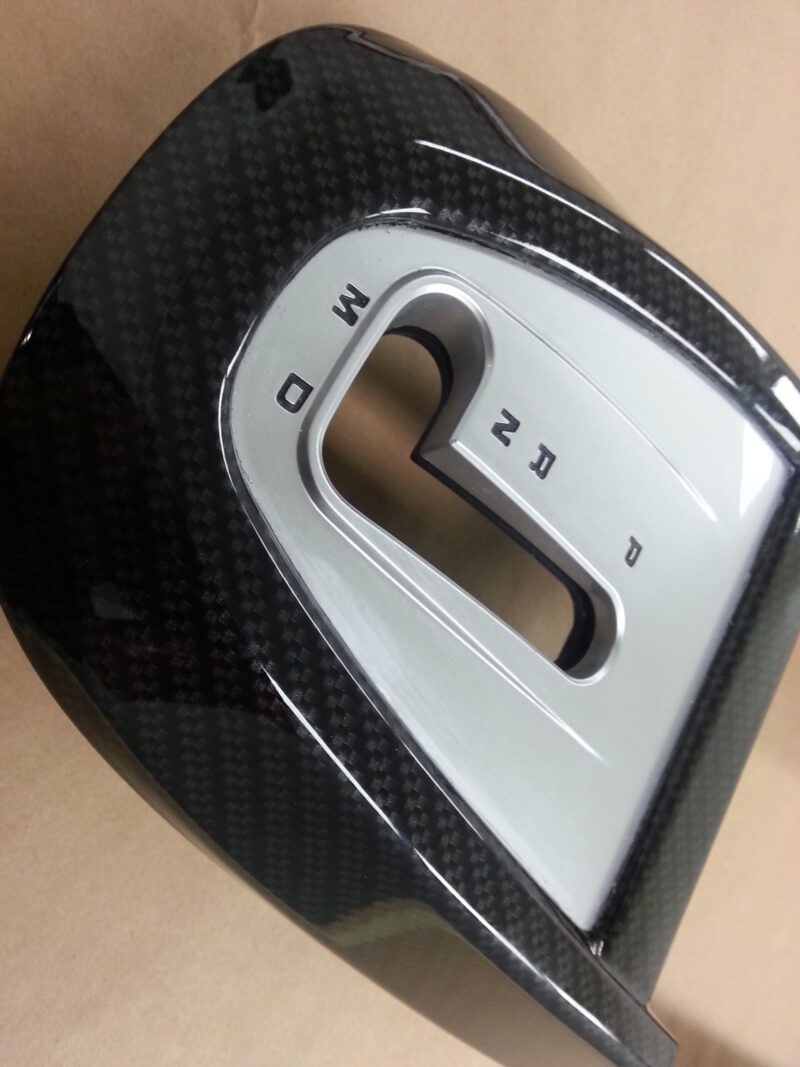 Car interior part coated in carbon fibre hydrographic film painted black