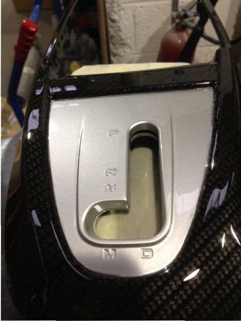 Car interior part coated in carbon fibre hydrographic film painted black
