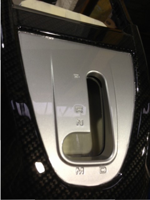 Car interior part coated in carbon fibre hydrographic film painted black
