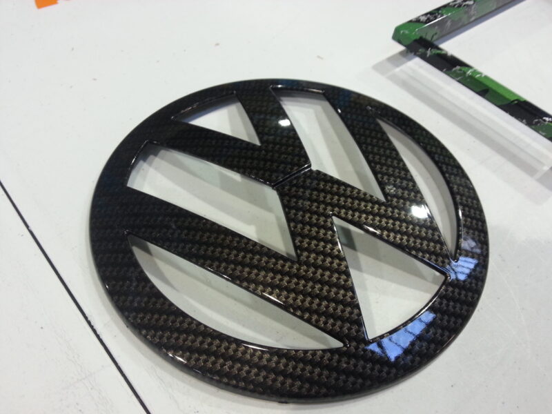 VW radiator grill coated in carbon fibre hydrographic film painted black