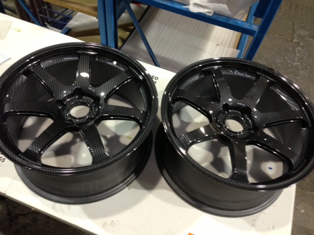 Car alloy wheels coated in carbon fibre