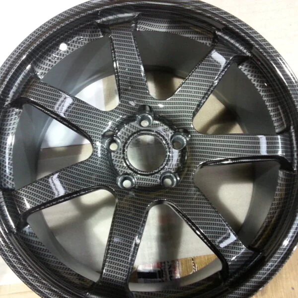 Car alloy wheels coated in carbon fibre hydrographic film painted grey
