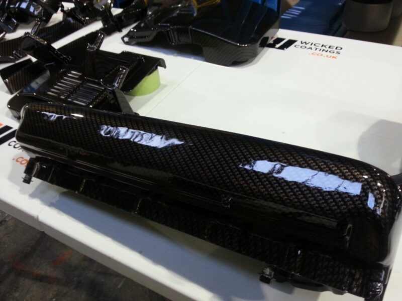 Ford Focus RS engine parts coated in carbon fibre hydrographic film painted black