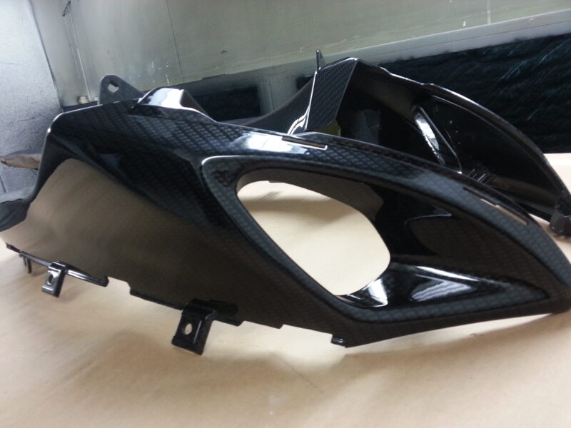 Motorbike parts coated in carbon fibre hydrographic film painted black