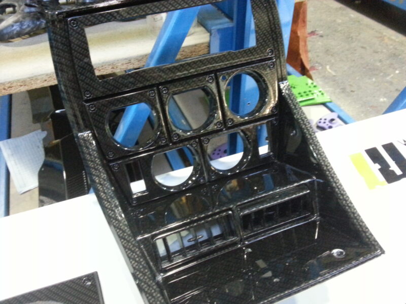 Car interior various elements coated in carbon fibre hydrographic film painted black